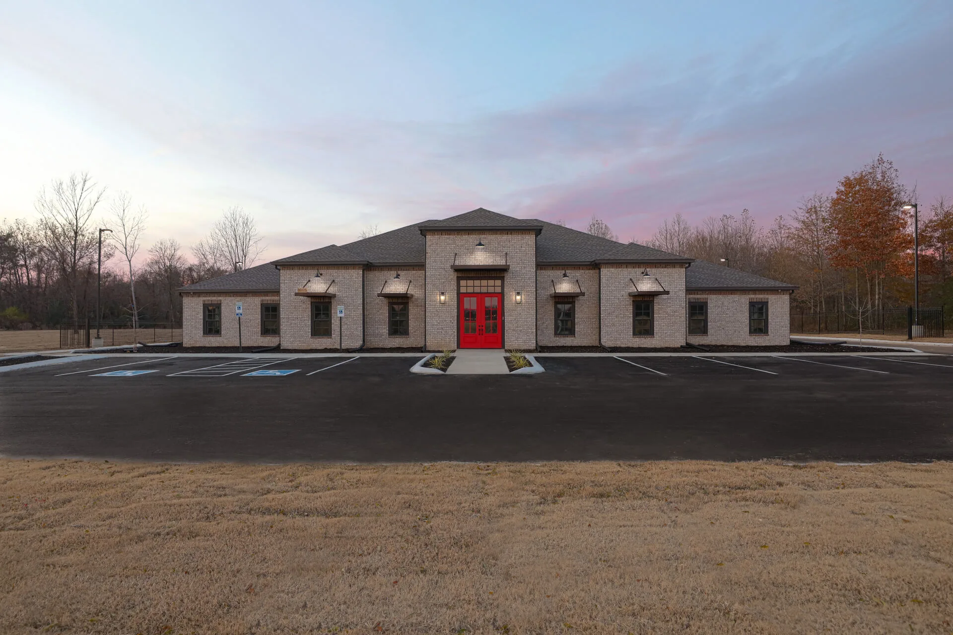 Corporate office and warehouse at twilight by Harber Built